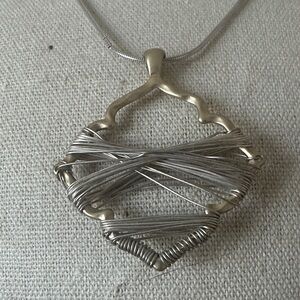 Silver and gold wrapped wire necklace.